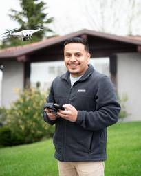 Photo shows one of the professional real estate drone photographers from Next Door Photos. 