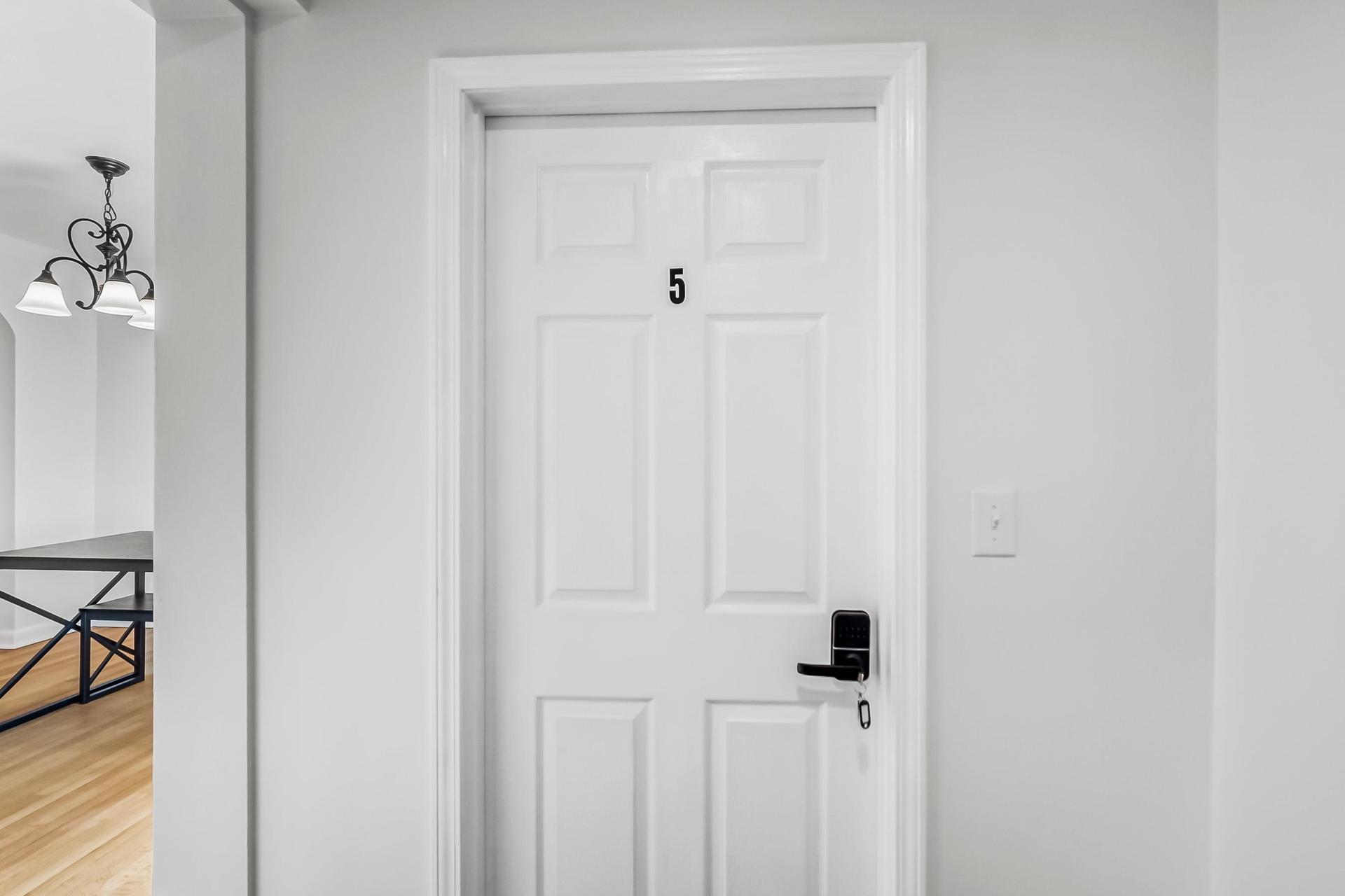 Secure bedroom door with digital lock.