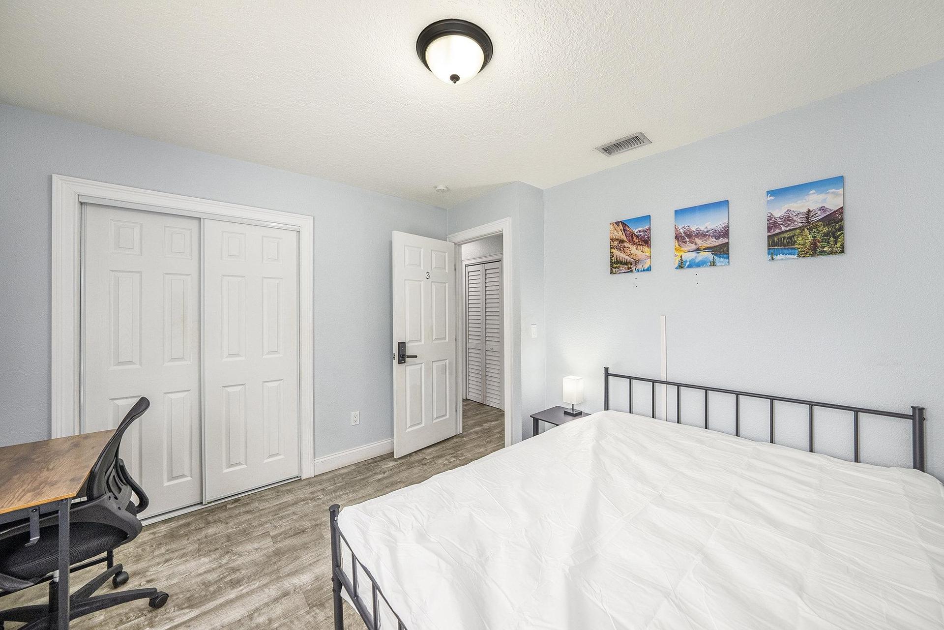 Spacious Room with a closet and desk.