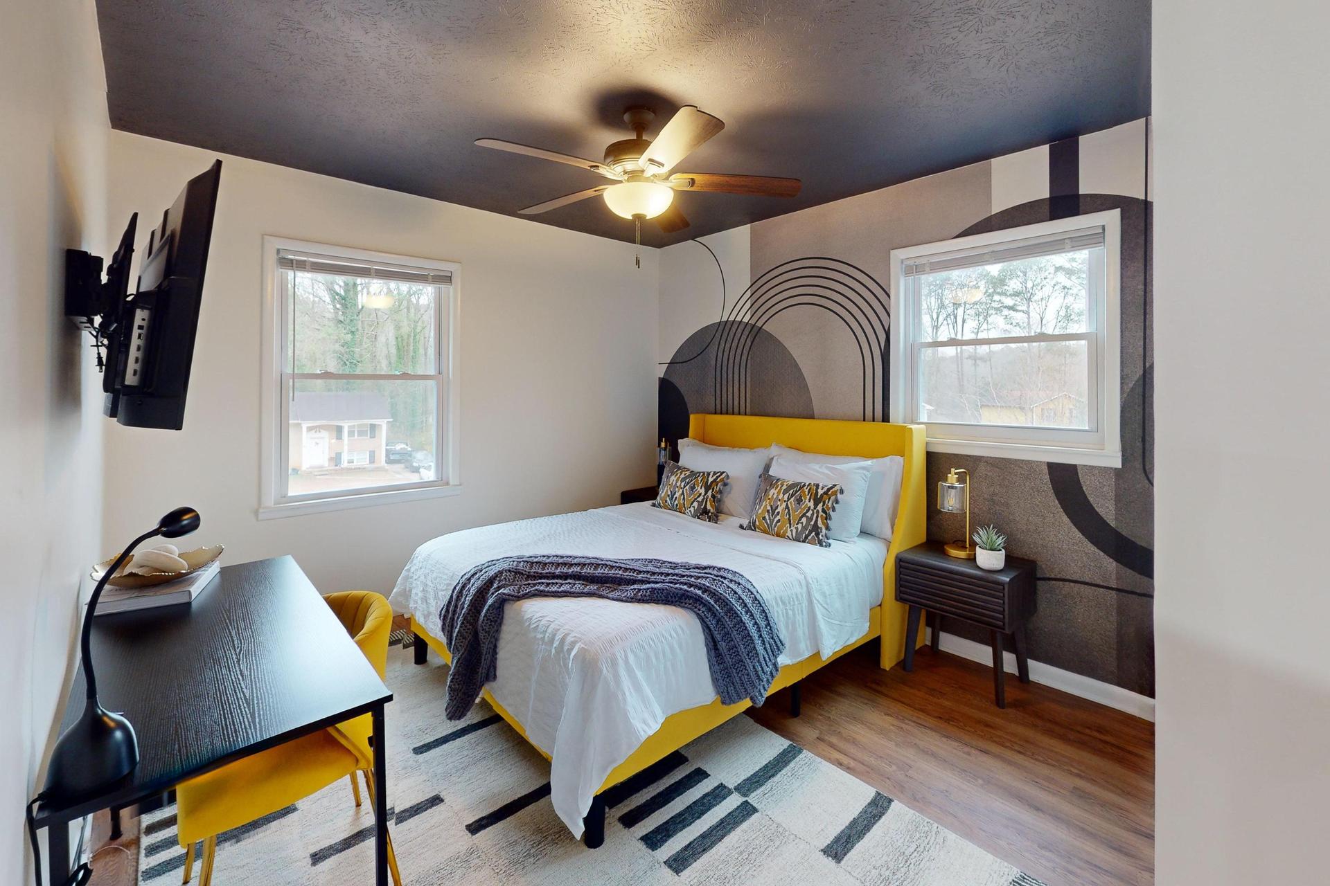 Queen Bedroom  with a desk and a TV