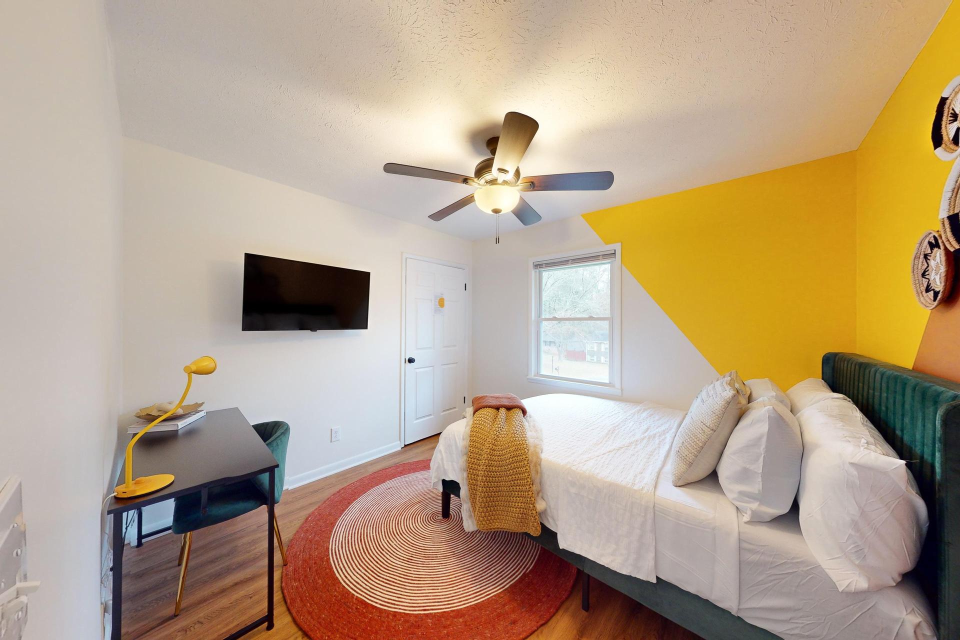 Queen Bedroom  with a Desk and a TV