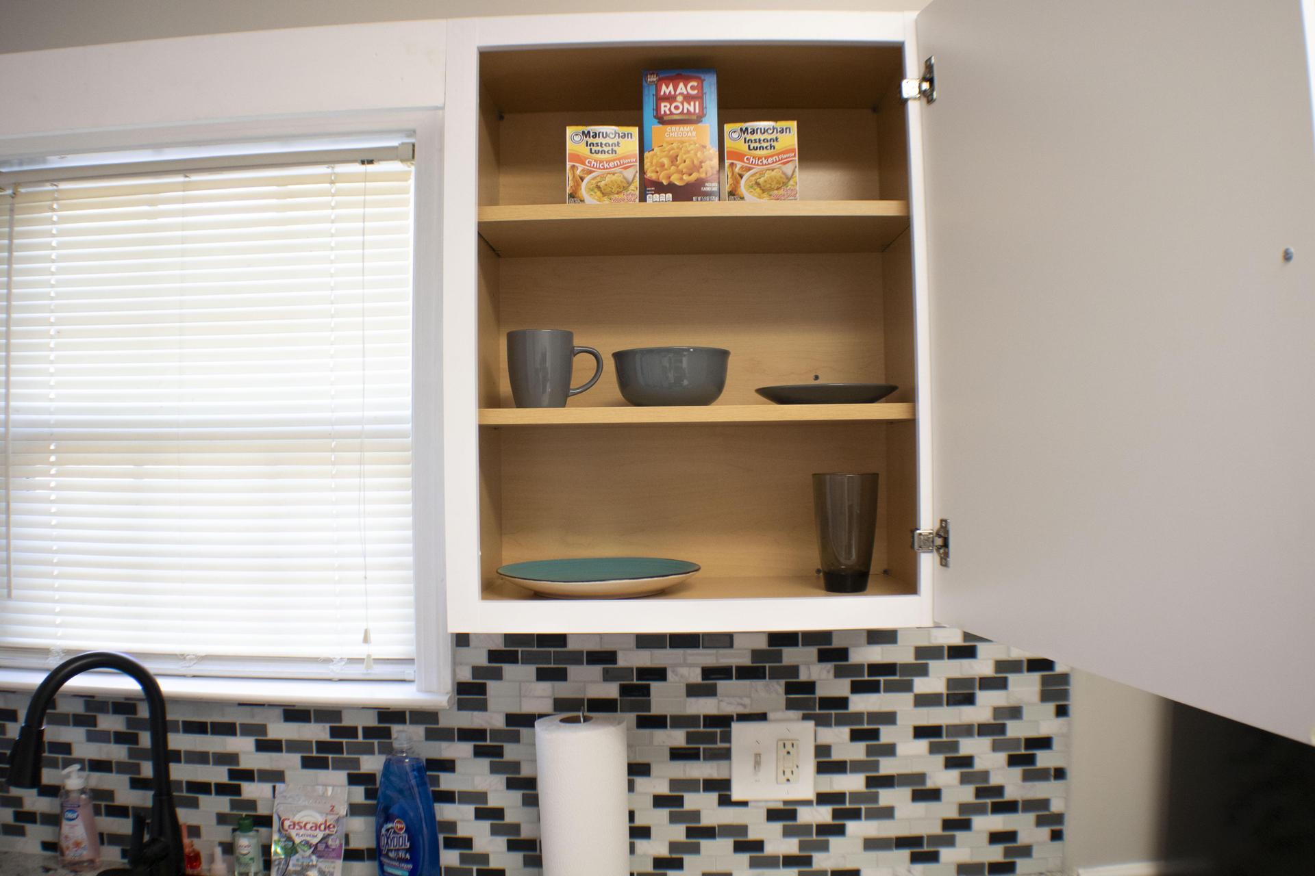 Kitchen labeled Cabinets with supplies