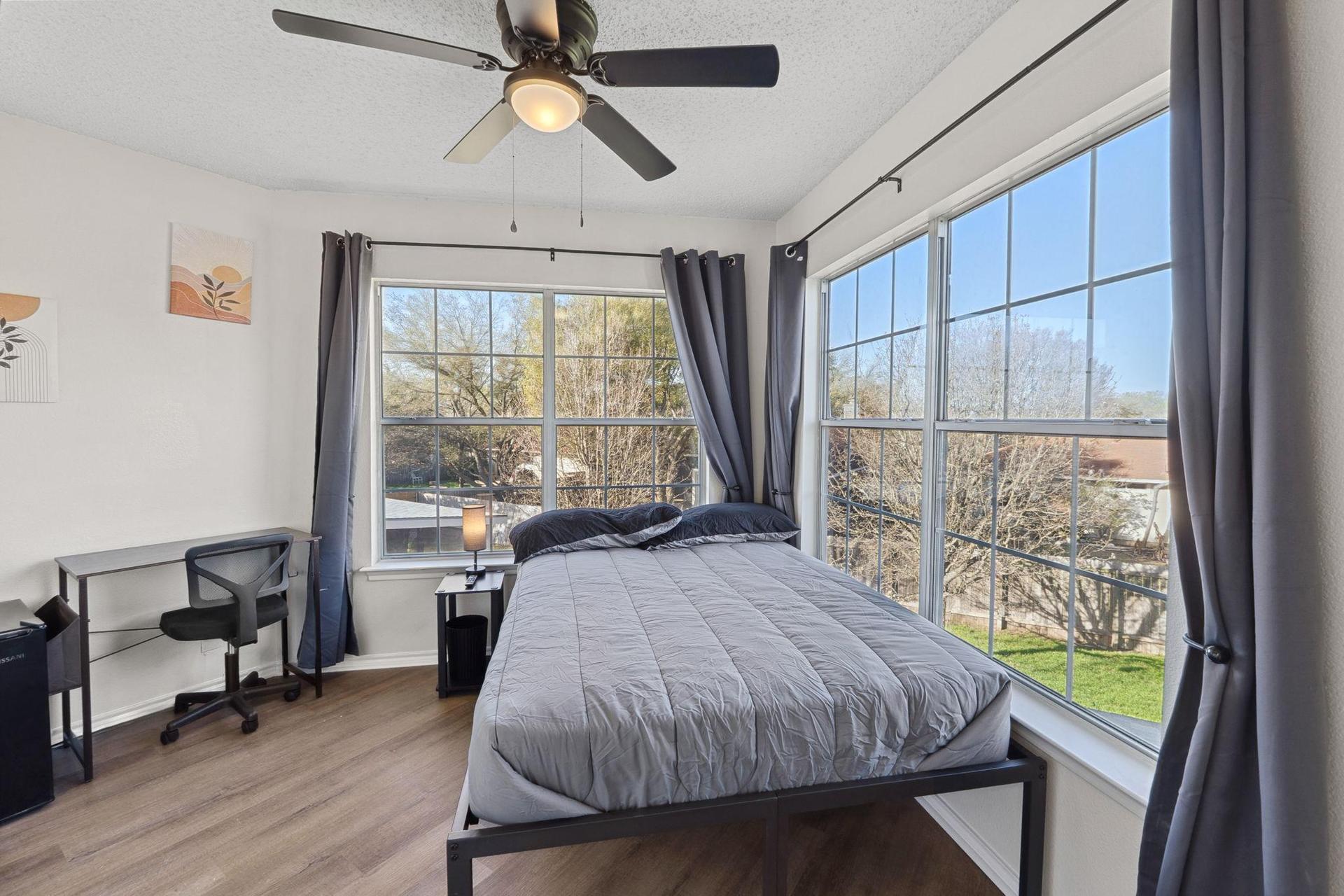 Bedroom large windows to bring in natural light.