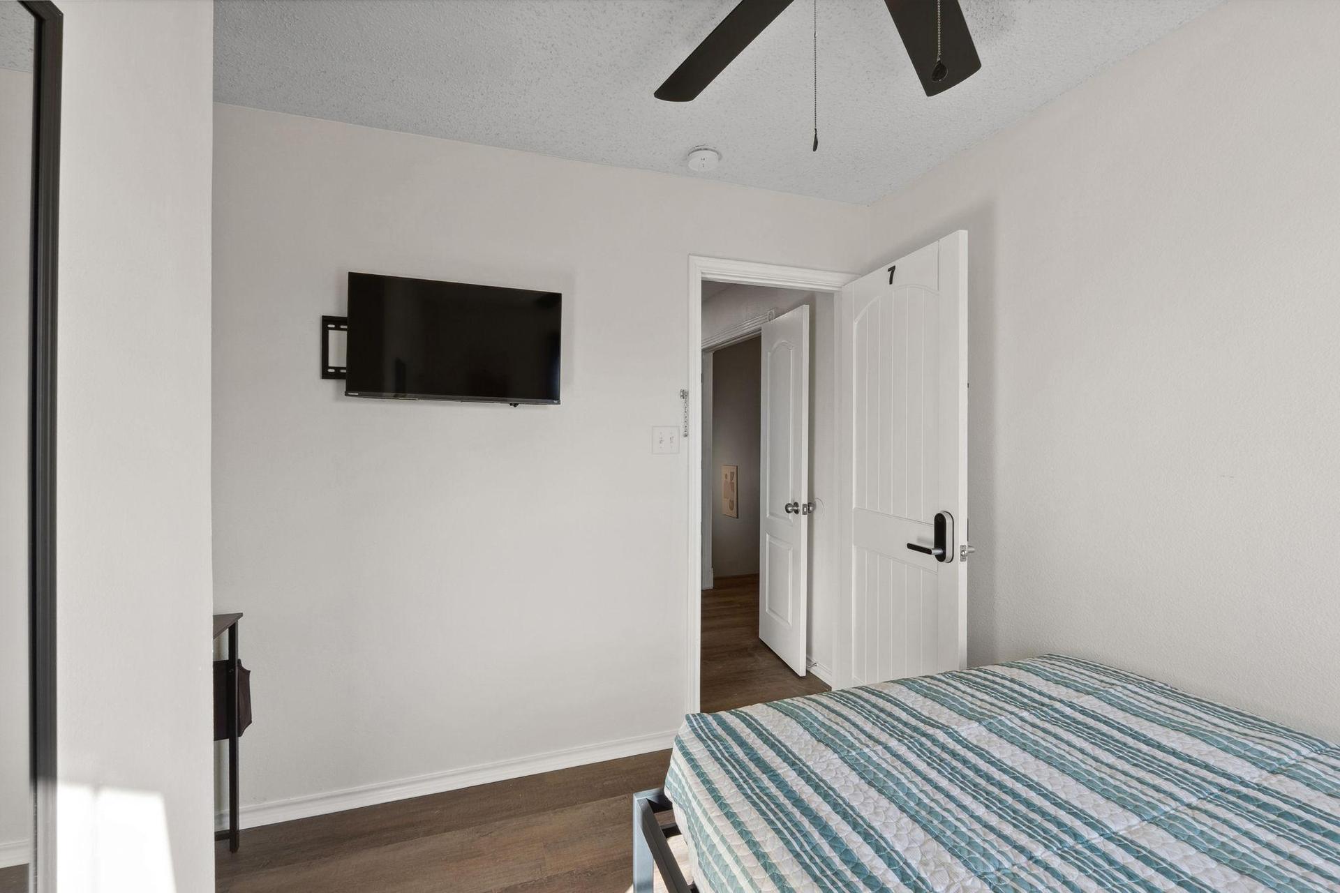 Bedroom large windows to bring in natural light.