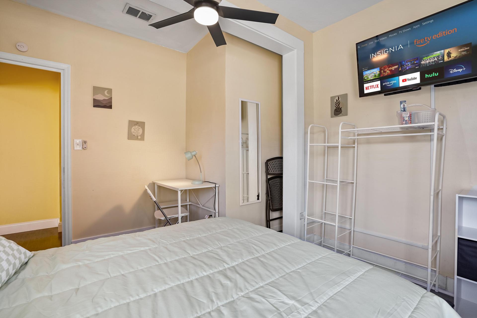 Room 1 has a private entry, full bed, linens, TV, mini fridge, desk, chair, nightstand, clothing rack,