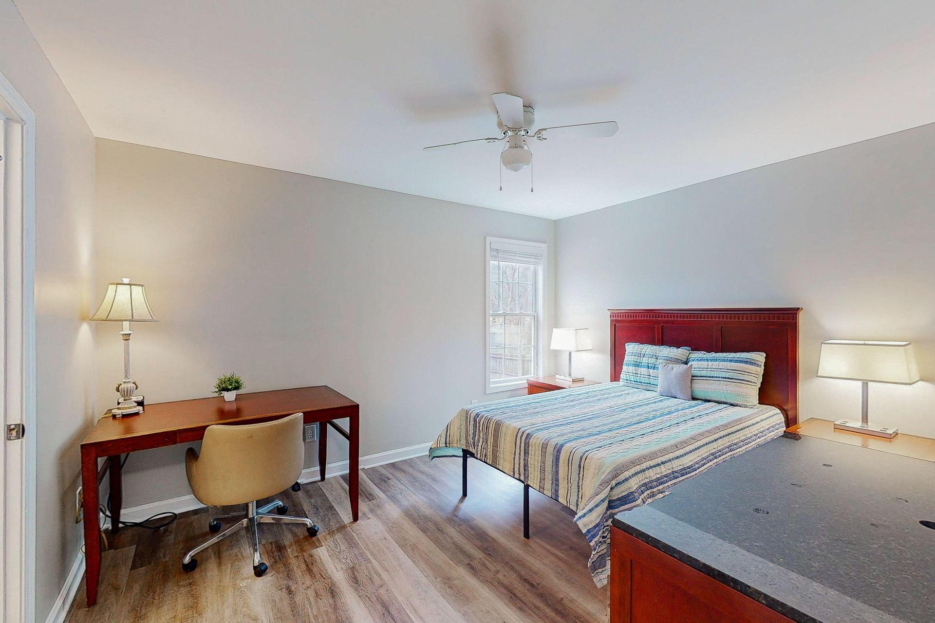 Downstairs Large Primary Bedroom 3 with desk and  private bath.