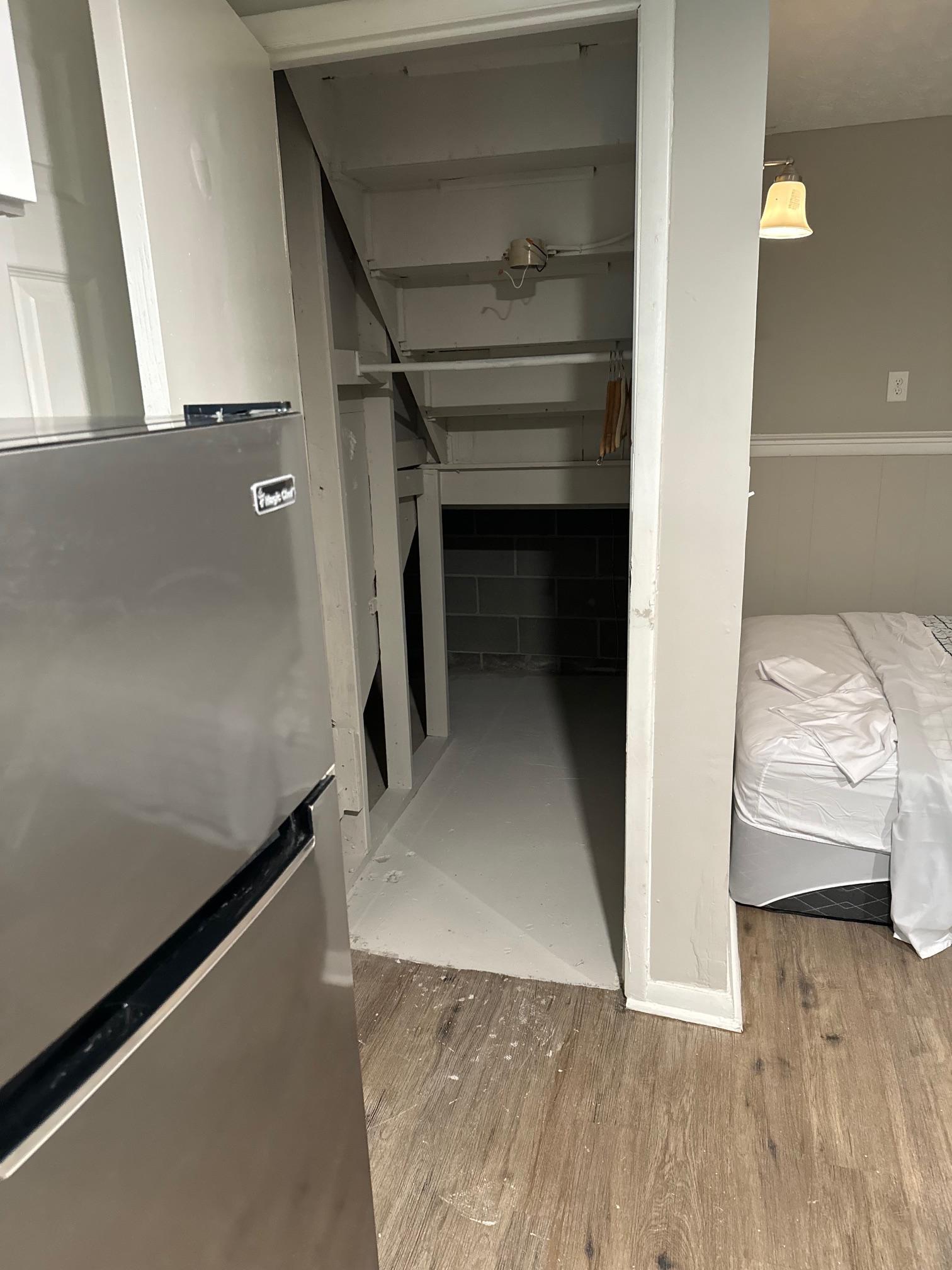 Under-stairs storage closet space