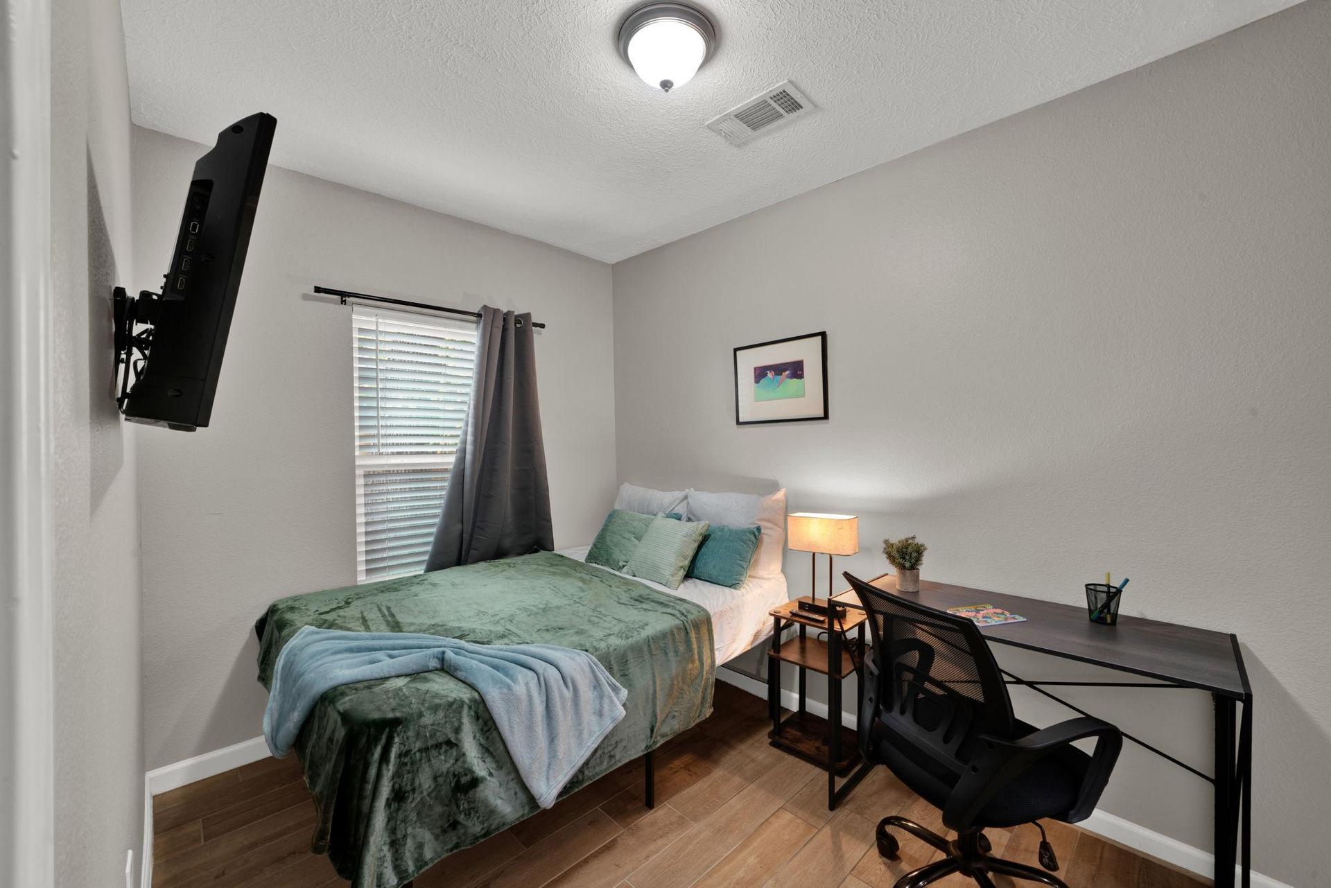 Premium room with workspace, blackout curtains, and TV all included