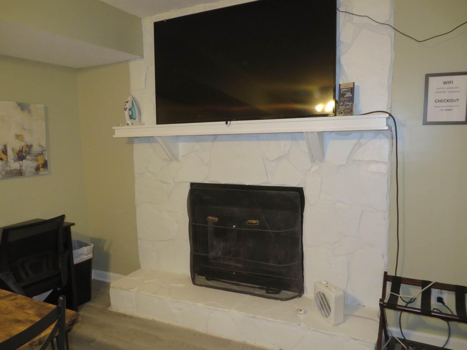 decorative chimney.  55" TV with streaming channels