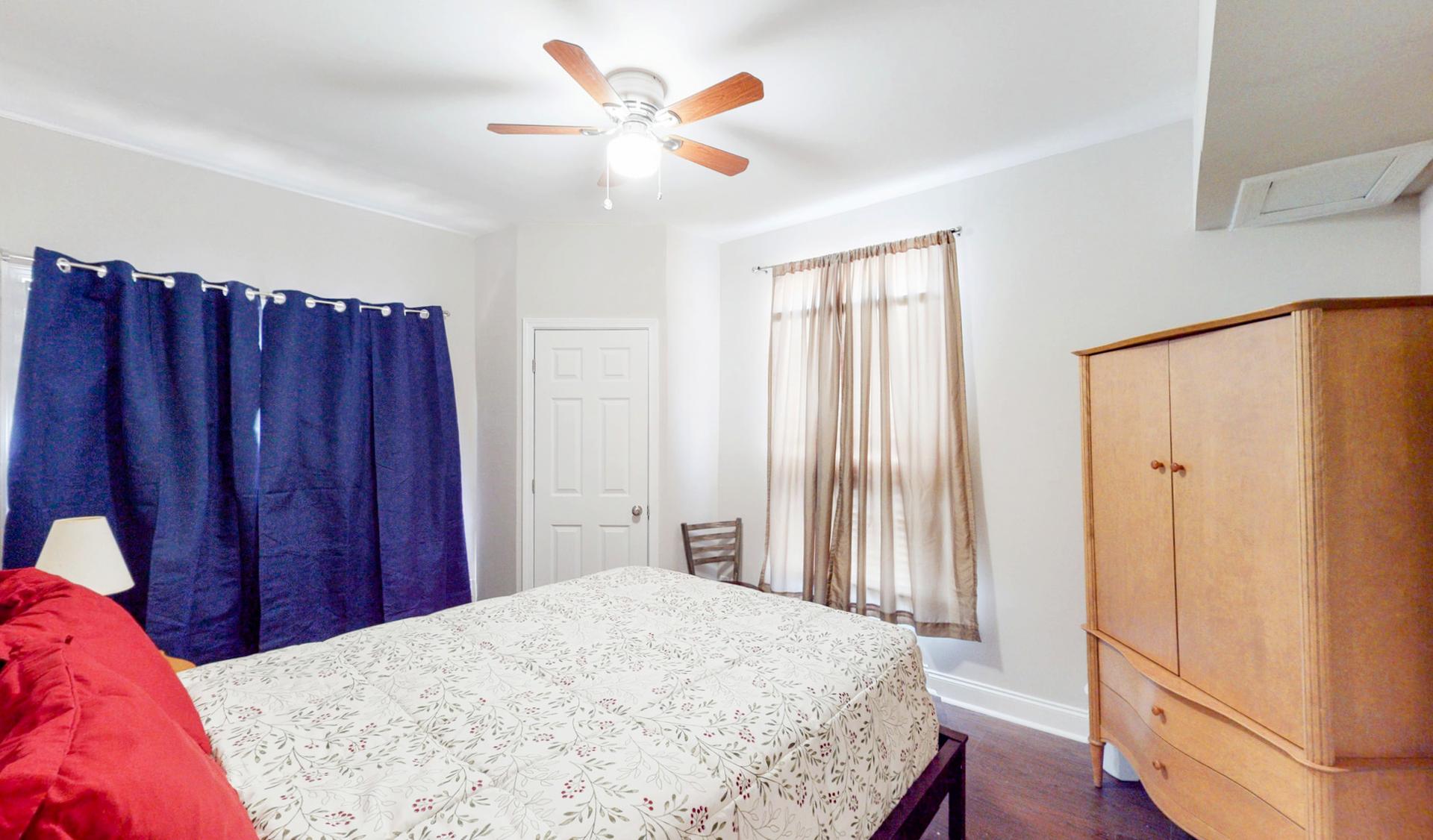 Bedroom 2 with queen bed, closet and credenza.