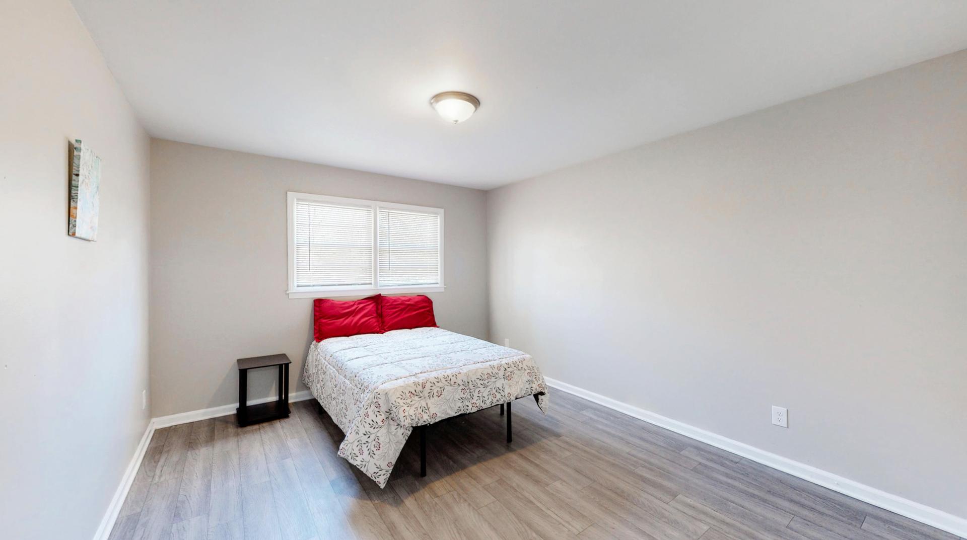 Large-sized upper level bedroom.