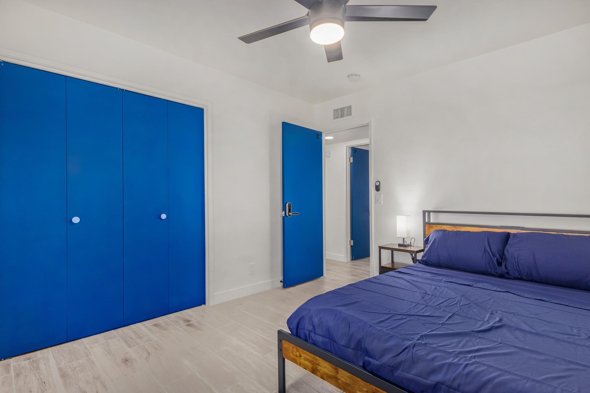 Large closet, working station and full length mirror behind the door.