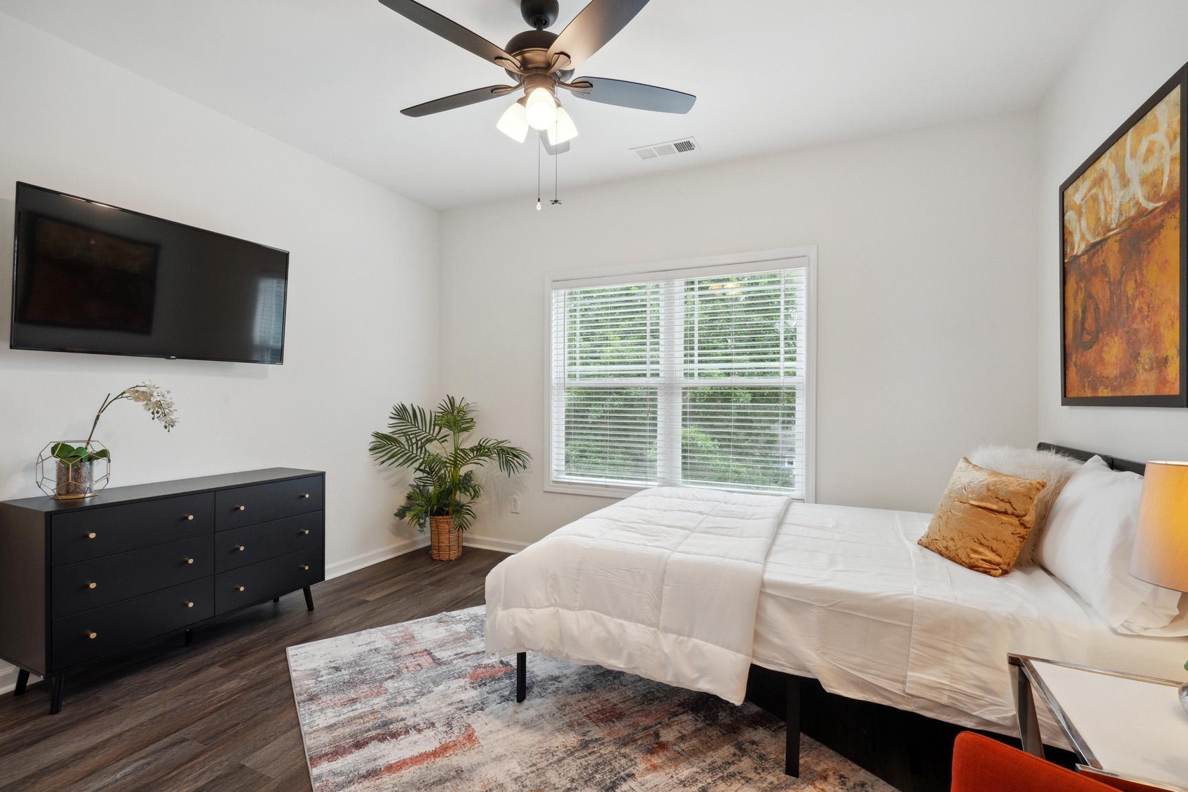 Another View of the Room with Large Dresser and Large TV