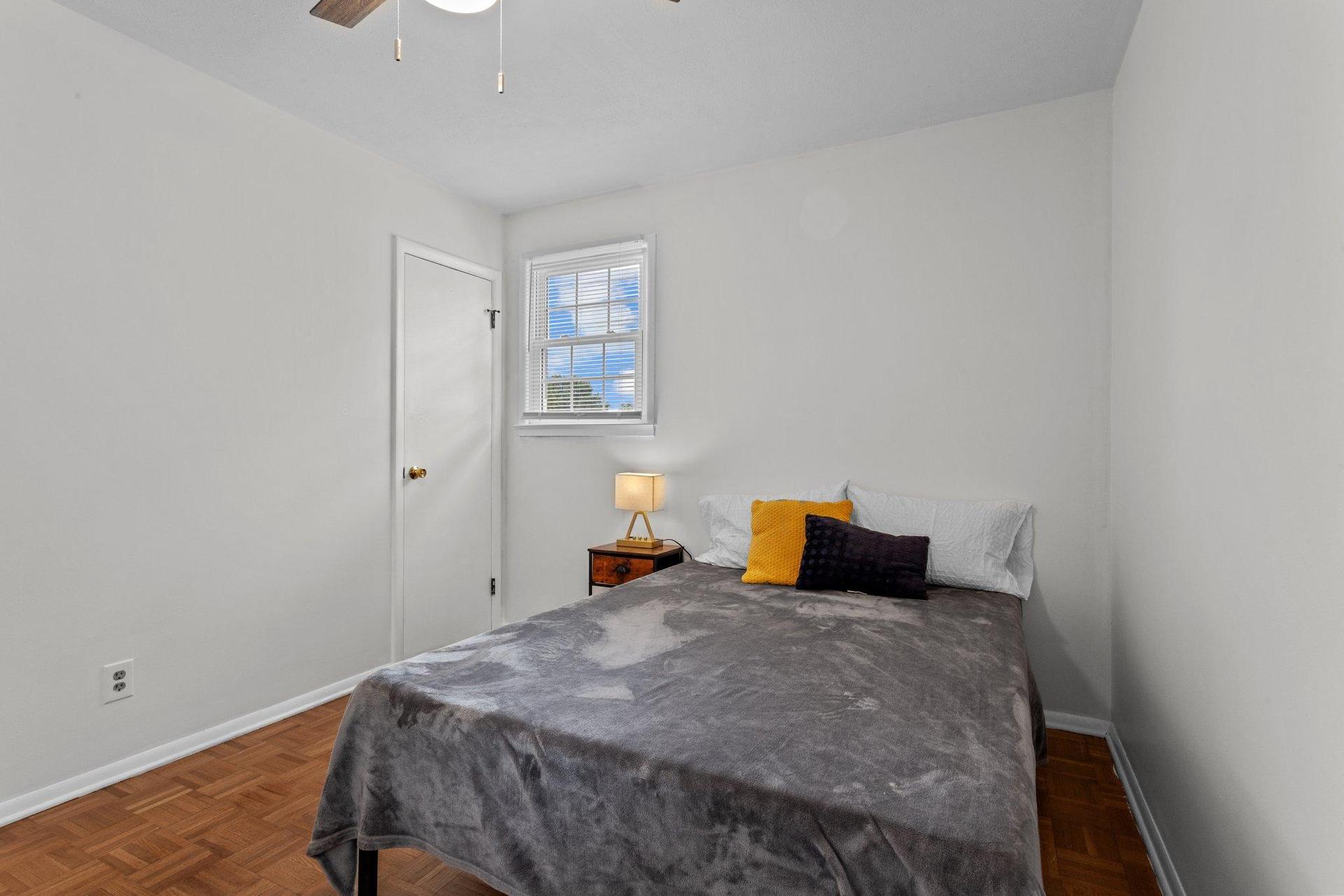 Spacious room with reach in closet and overhead fan