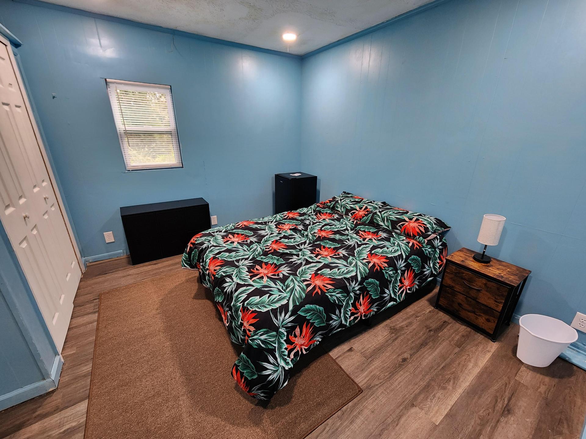 Thoughtfully decorated and furnished bedroom with a shared bathroom.