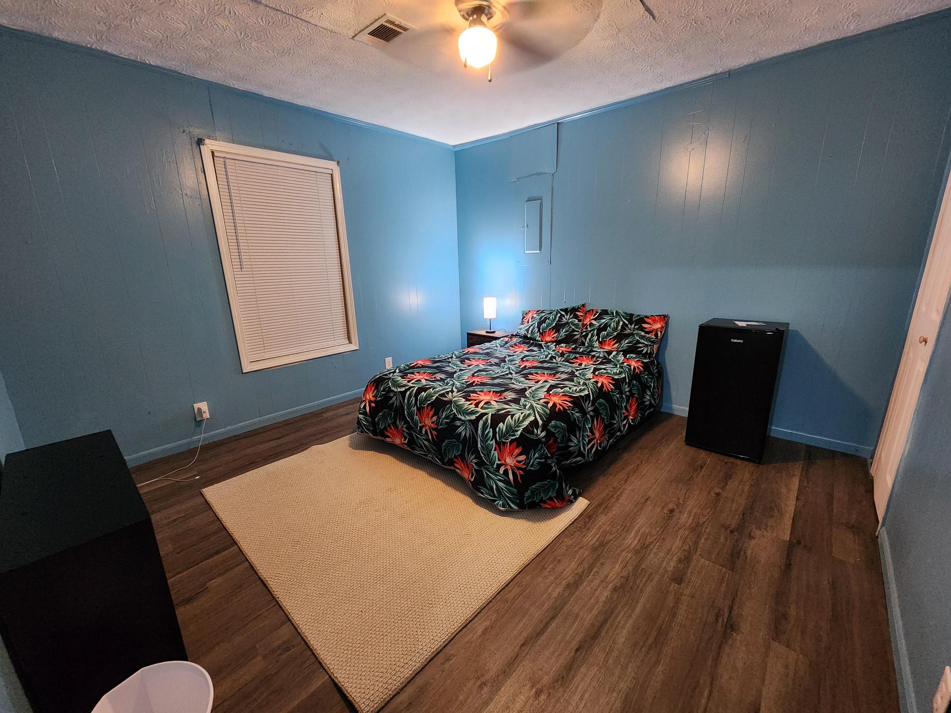 Large and freshly remodeled bedroom next to shared bathr