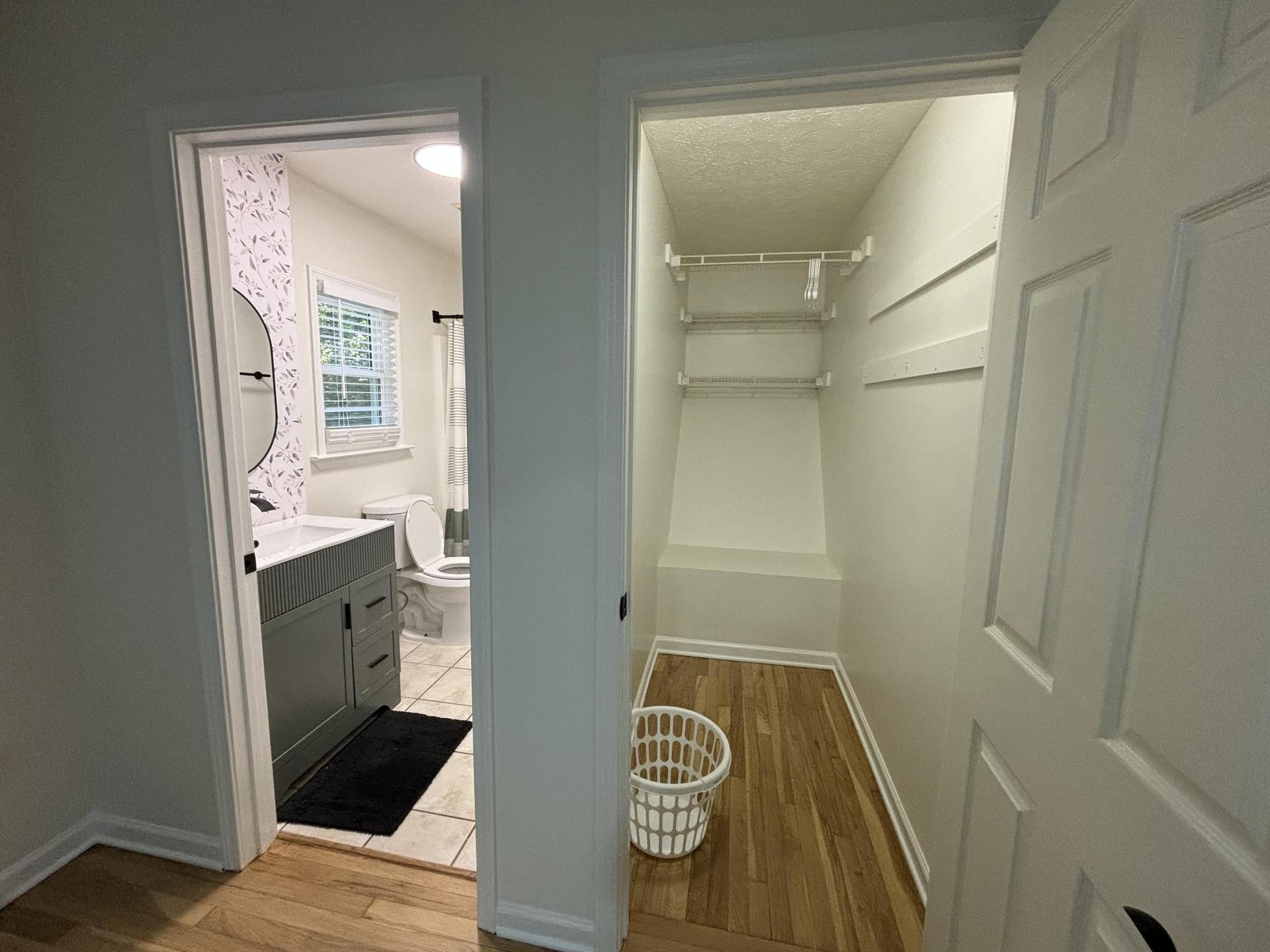 Private master bathroom with vanity storage and a shower/tub combo right next to a HUGE walk in closet with tons of storage!