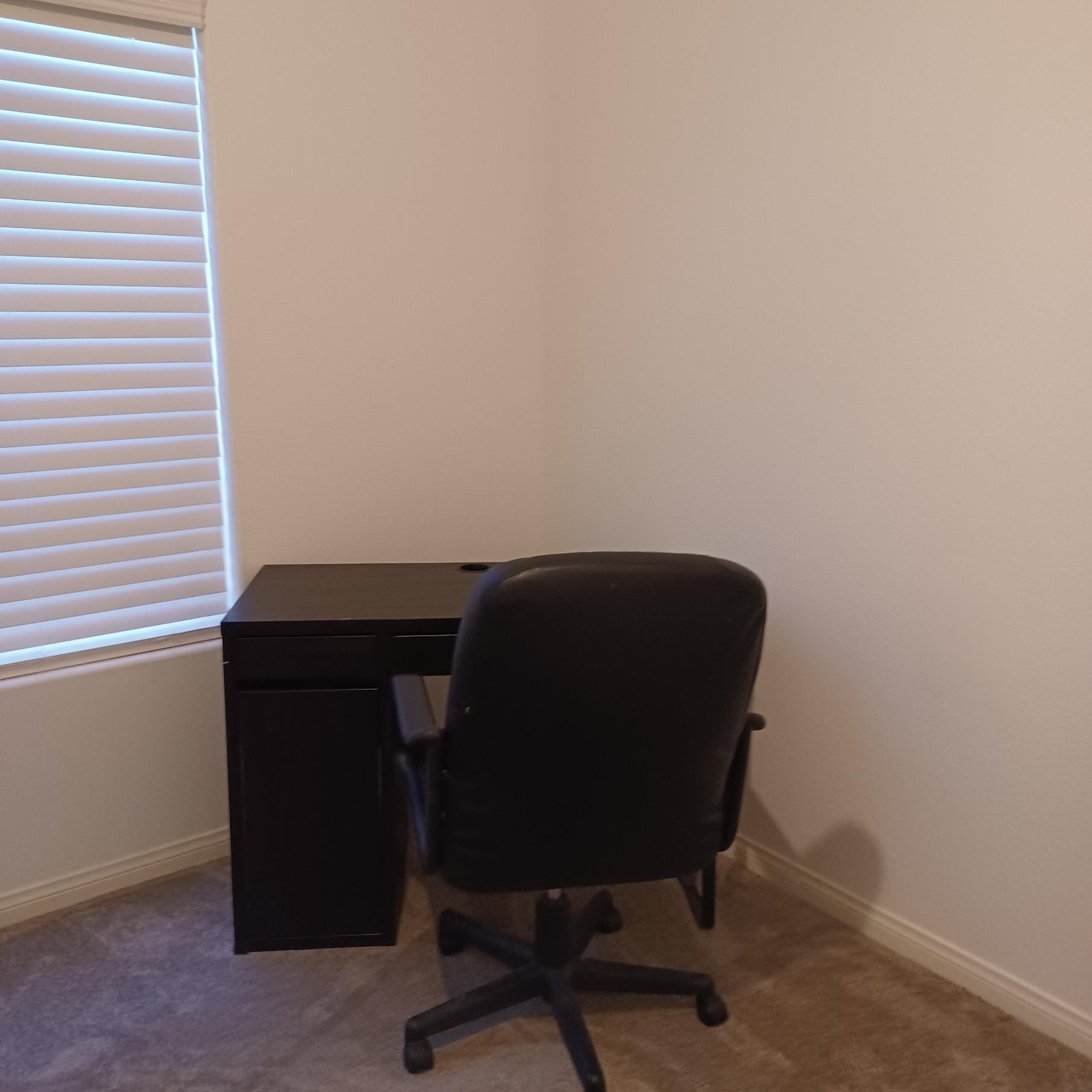 Desk and chair in room