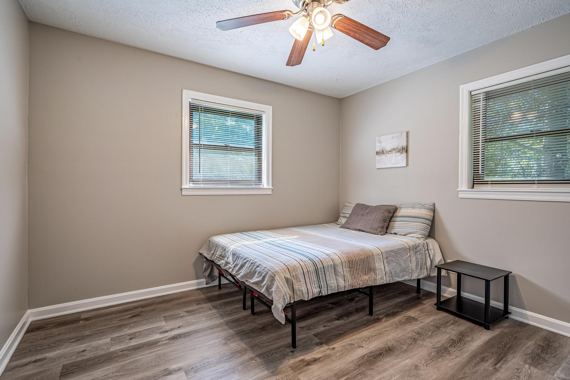 bedroom, detected: window blind, ceiling fan, bed