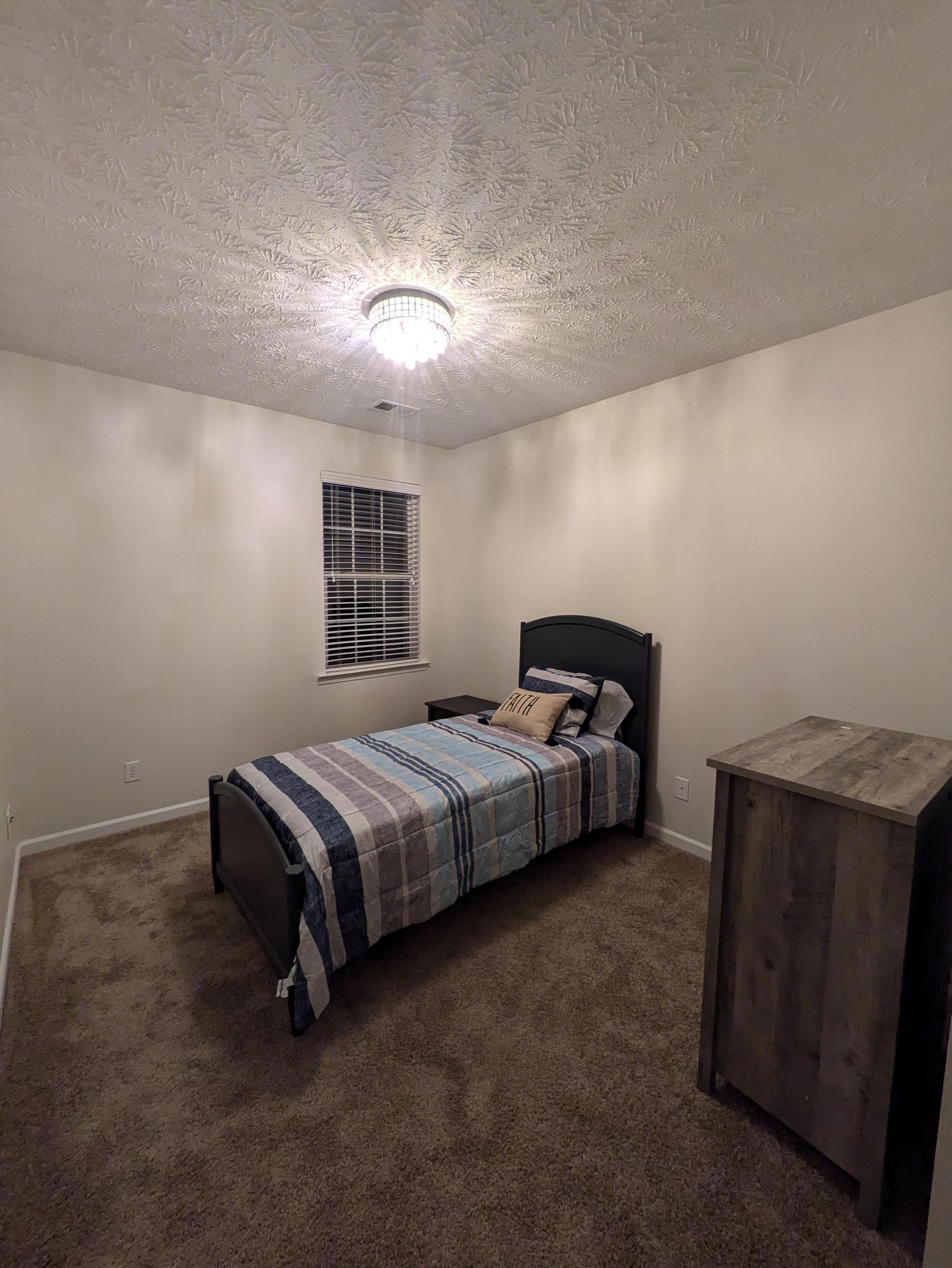 Cozy bedroom with twin bed