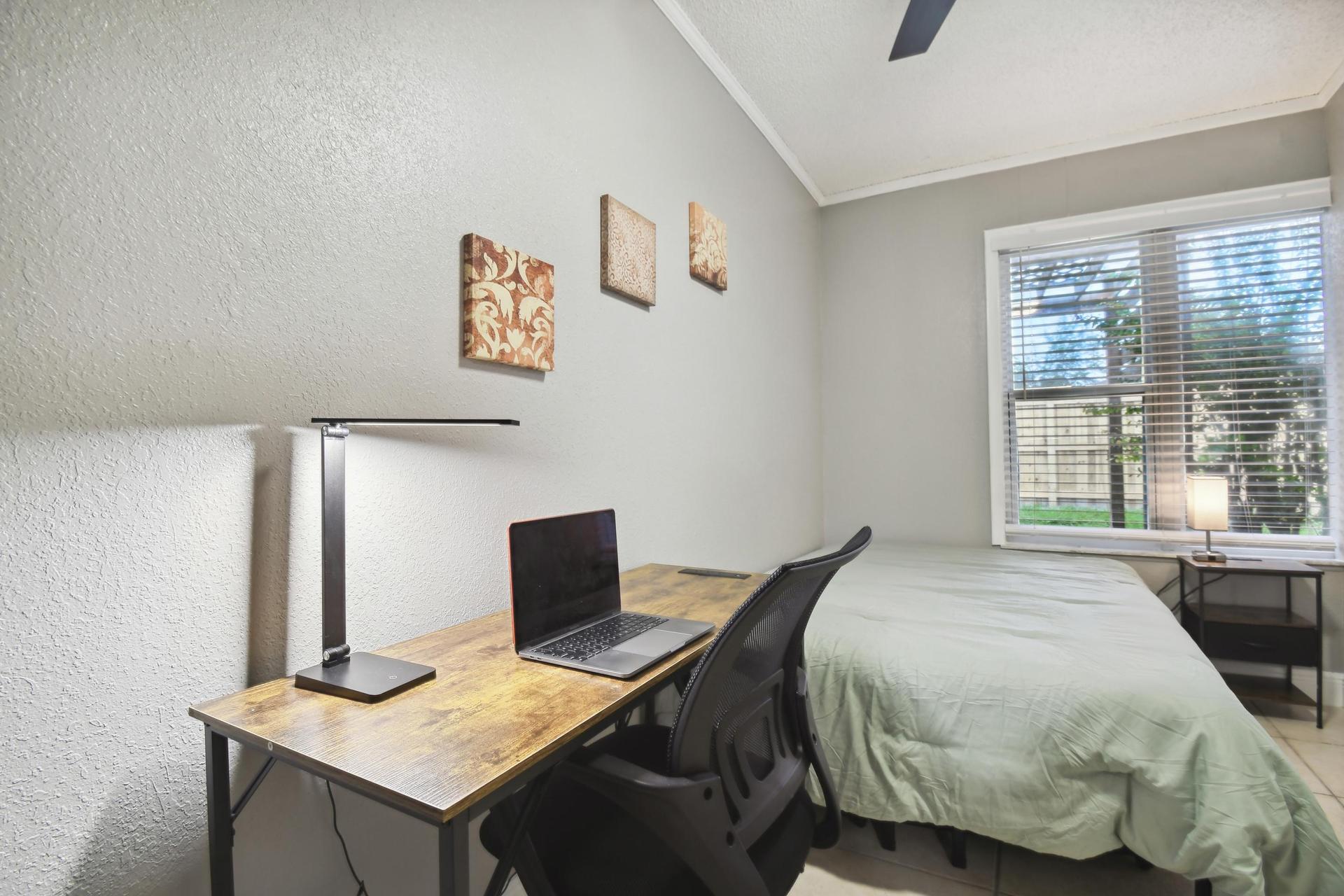 Office desk and chair with extra light.