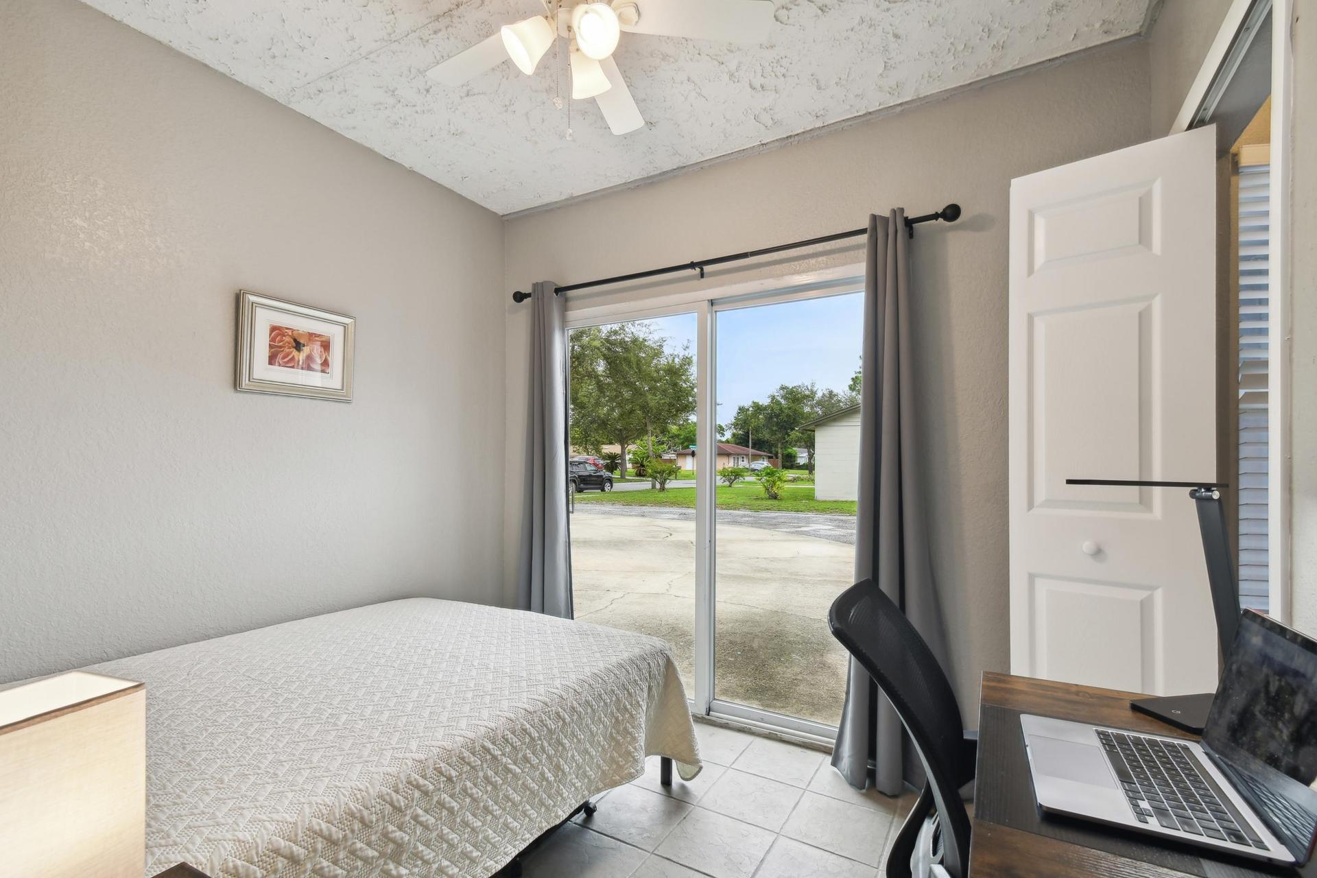 Full size cozy bed, with end table, light and storage container under the bed.  Black out curtains for own personal slider