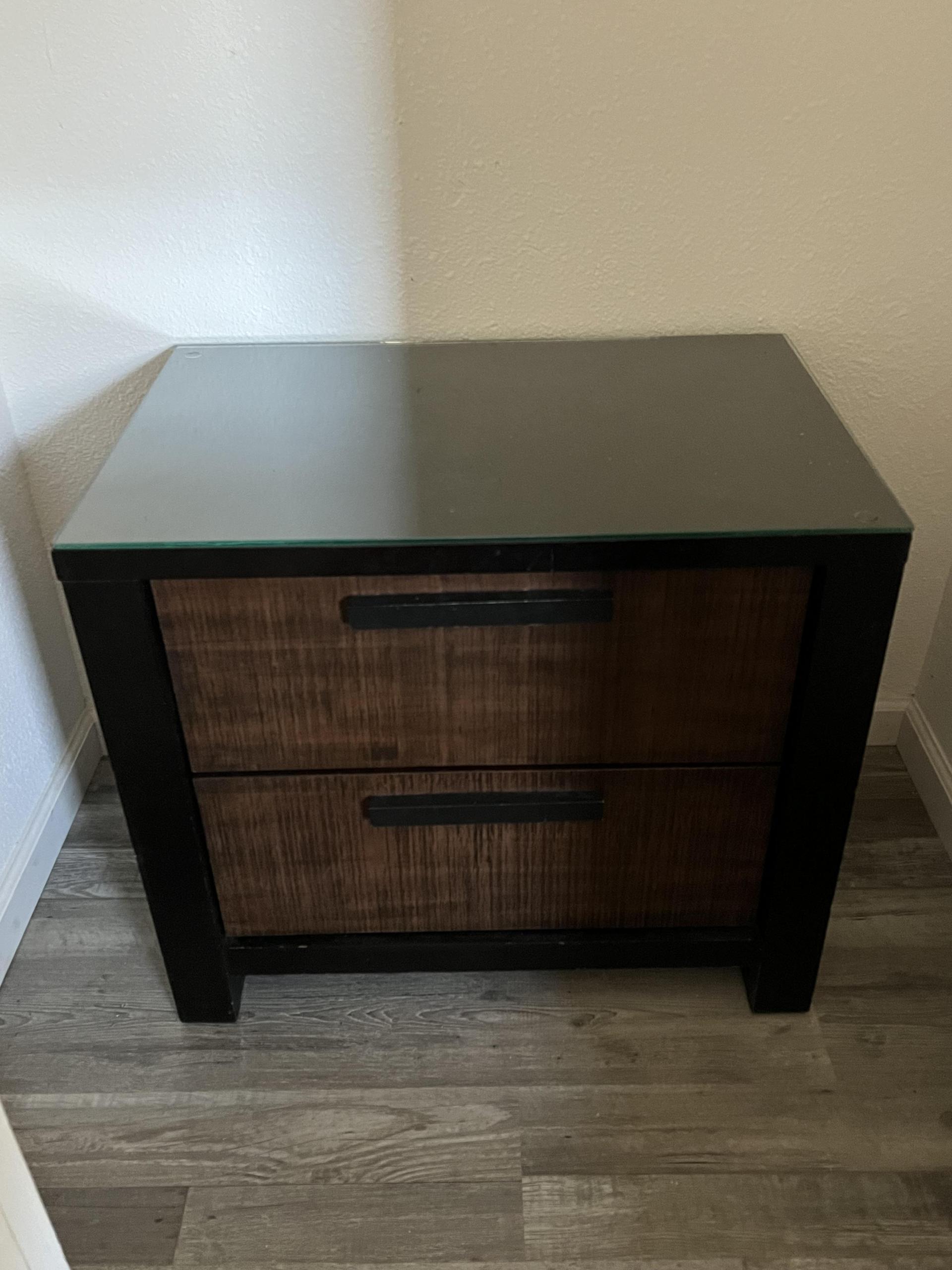 Dresser doubles as TV stand with glass top.