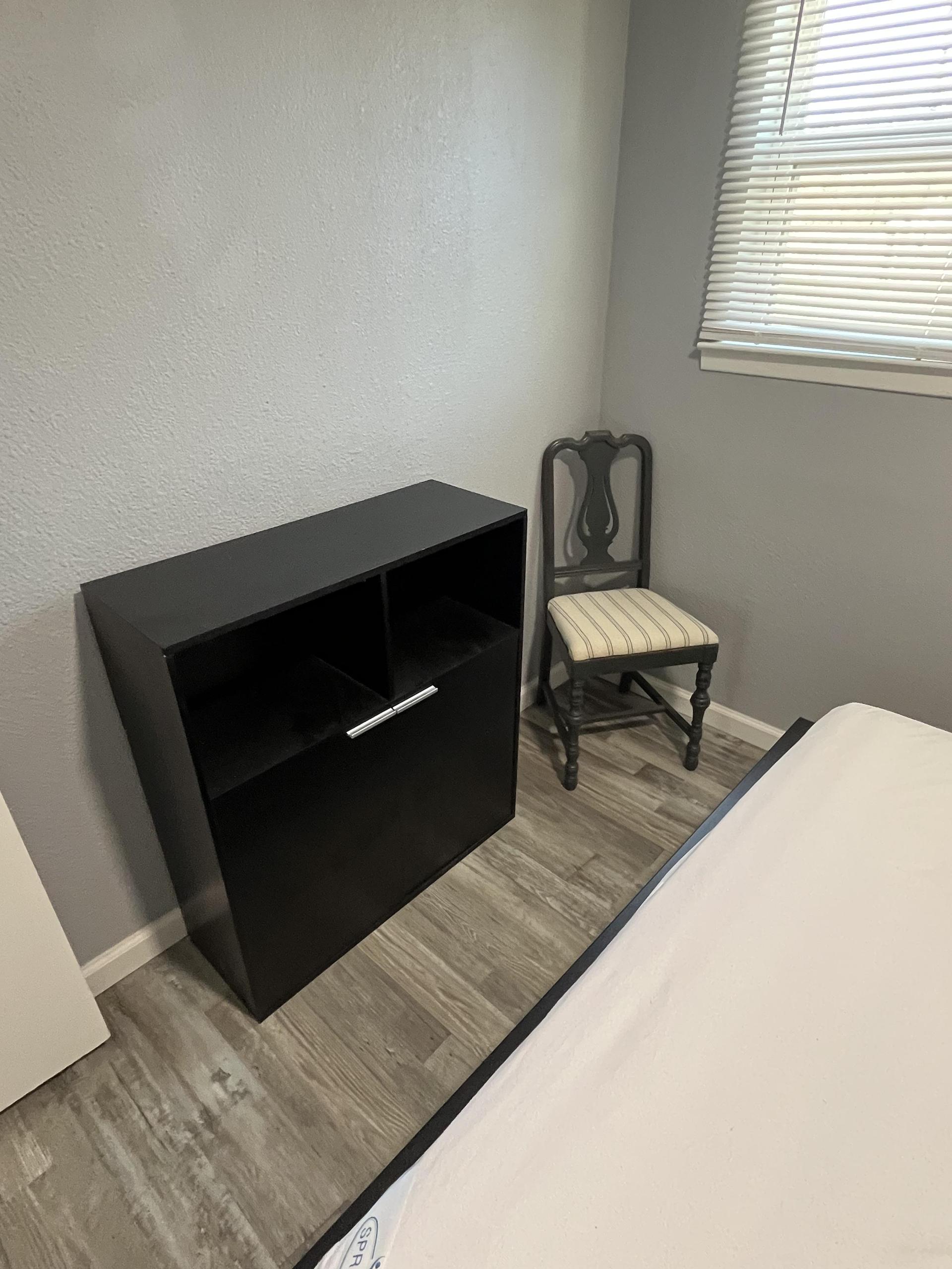 Cabinet for personal dry food storage and seating.