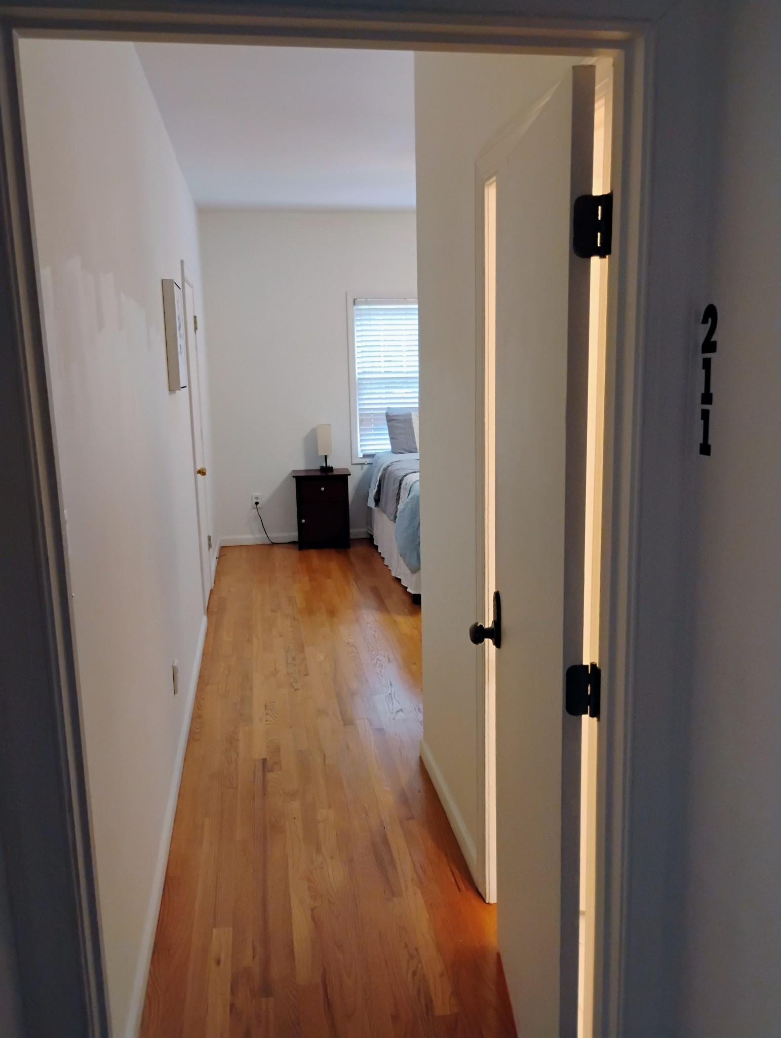 Long view entrance into bedroom 211