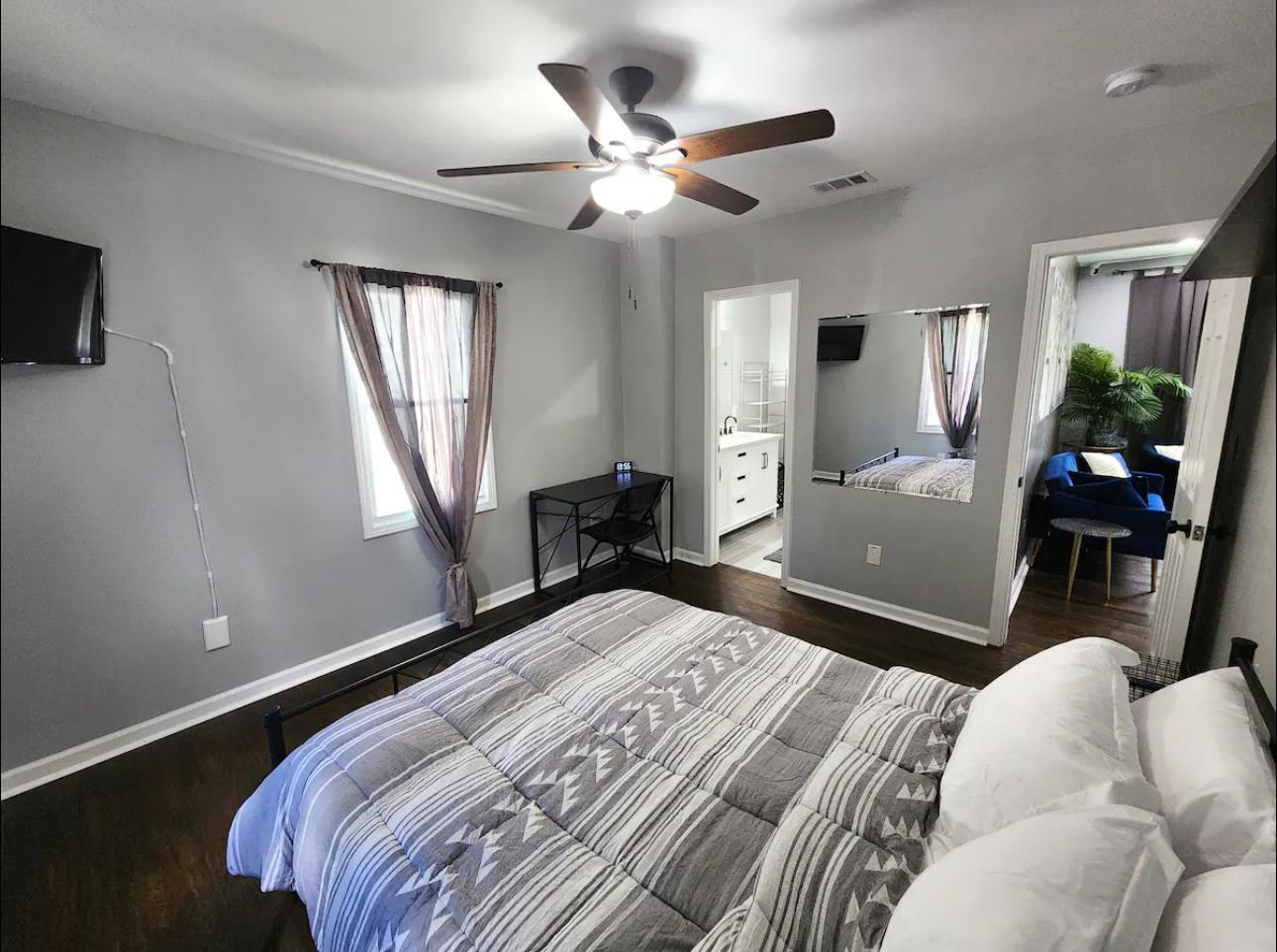 Master room with private bathroom and TV