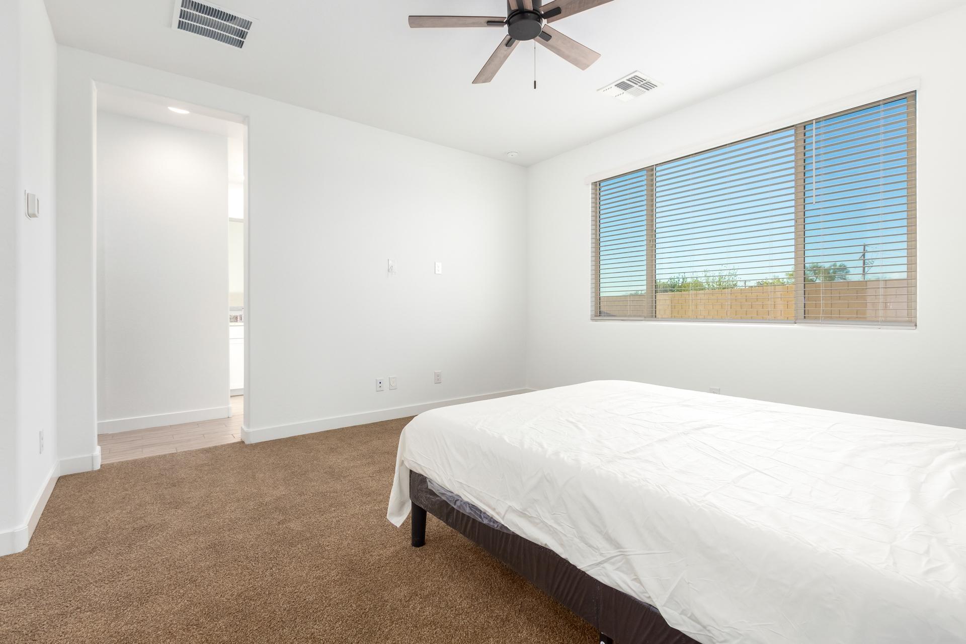 Primary Bedroom with ceiling fan