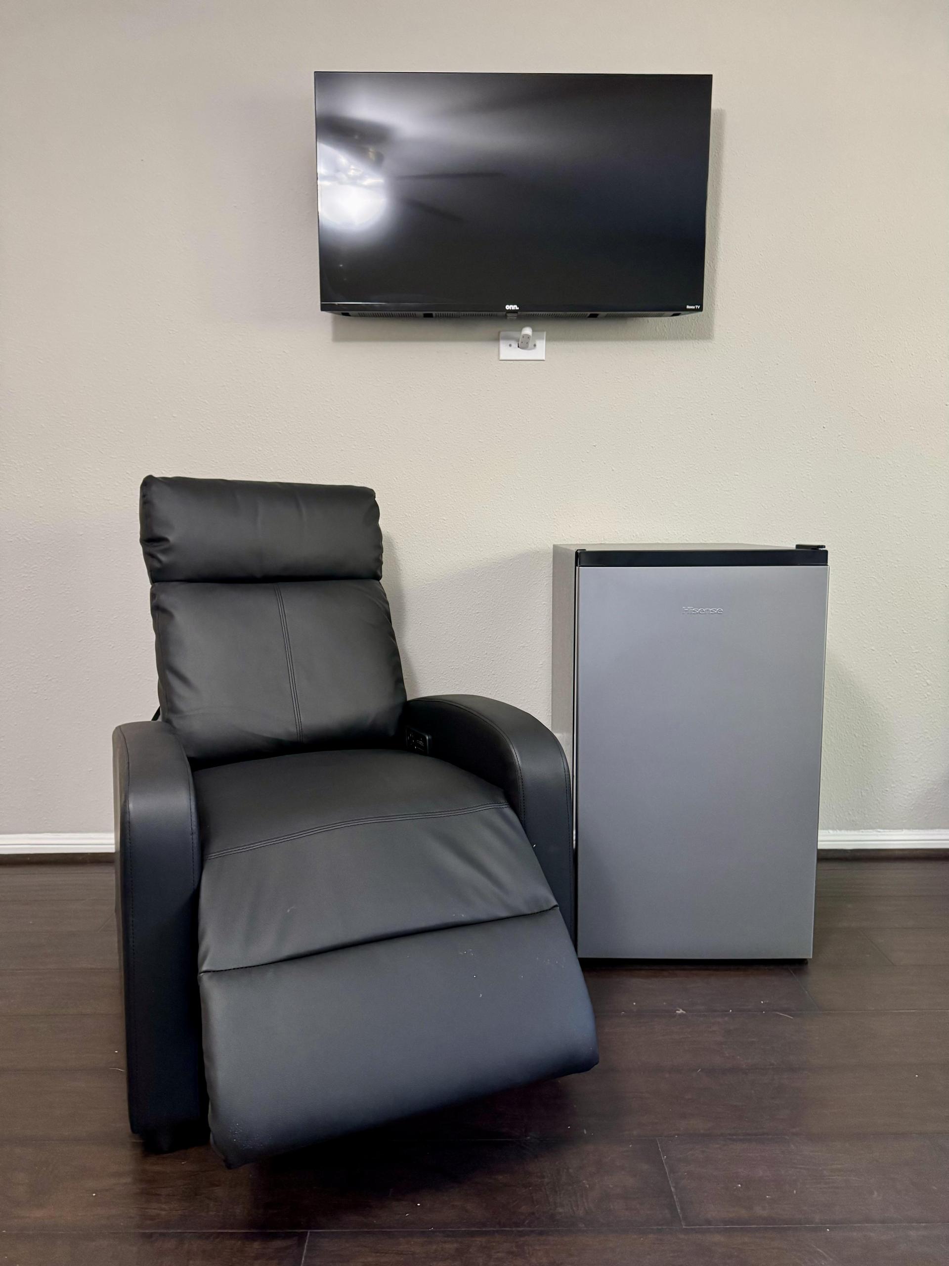 All rooms include a comfy recliner, mini-fridge, and a 40” wall mounted LCD smart TV